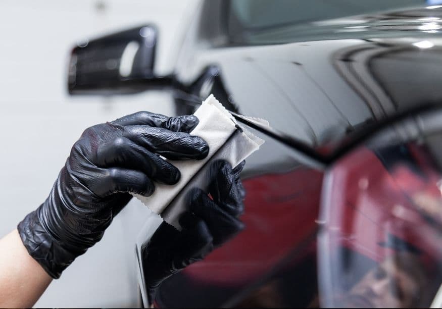 Ceramic coating being applied to glossy black paint — ceramic coating vs wax in a Vancouver winter