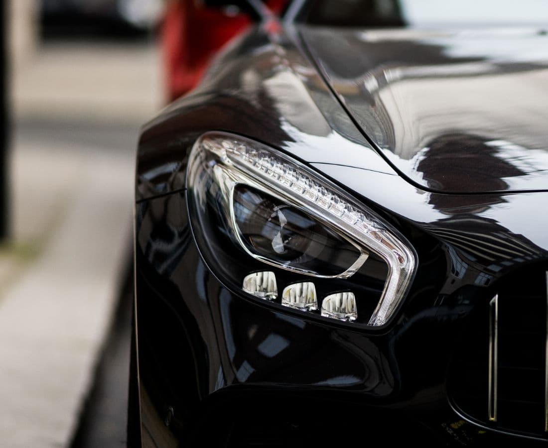 Crystal-clear restored headlight on a black Mercedes — headlight restoration result in Vancouver